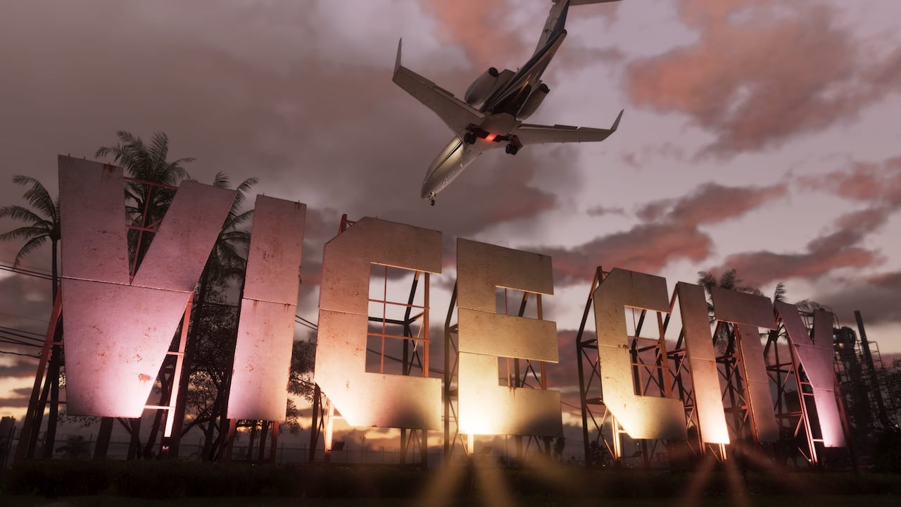 A passenger jet flies above the Vice City sign at sunset